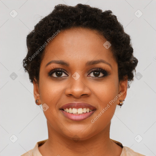 Joyful black young-adult female with short  brown hair and brown eyes