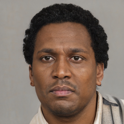 Neutral latino adult male with short  black hair and brown eyes