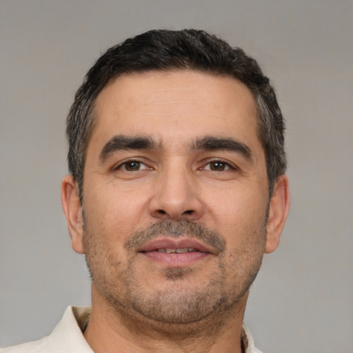 Neutral white adult male with short  black hair and brown eyes