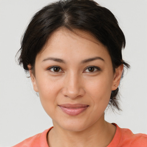 Joyful white young-adult female with medium  brown hair and brown eyes