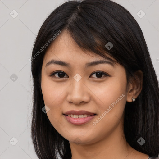 Joyful asian young-adult female with long  brown hair and brown eyes