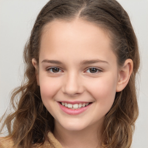 Joyful white child female with medium  brown hair and brown eyes