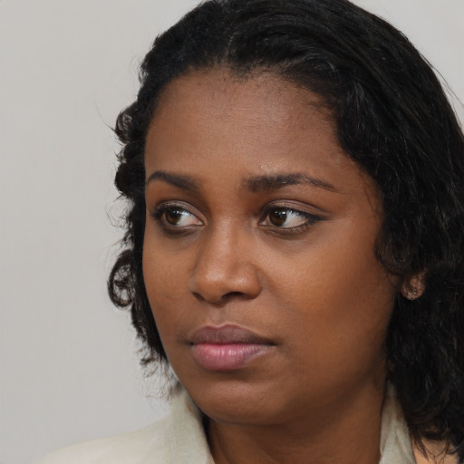 Neutral black young-adult female with long  black hair and brown eyes