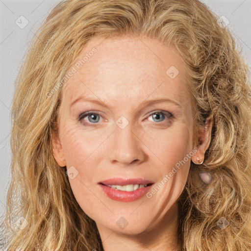 Joyful white adult female with long  brown hair and brown eyes