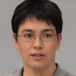 Neutral asian young-adult male with short  brown hair and brown eyes