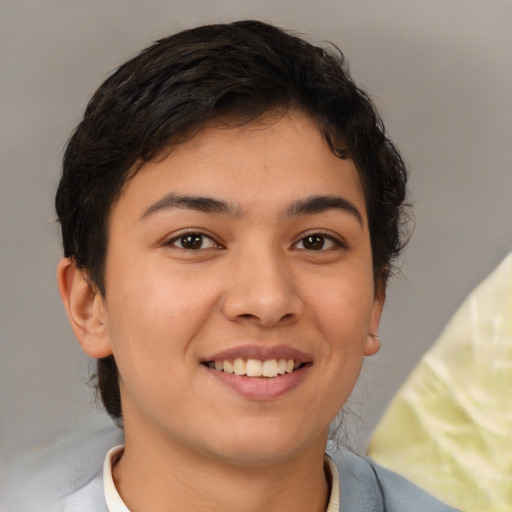 Joyful latino young-adult female with short  brown hair and brown eyes