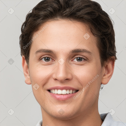 Joyful white young-adult female with short  brown hair and grey eyes