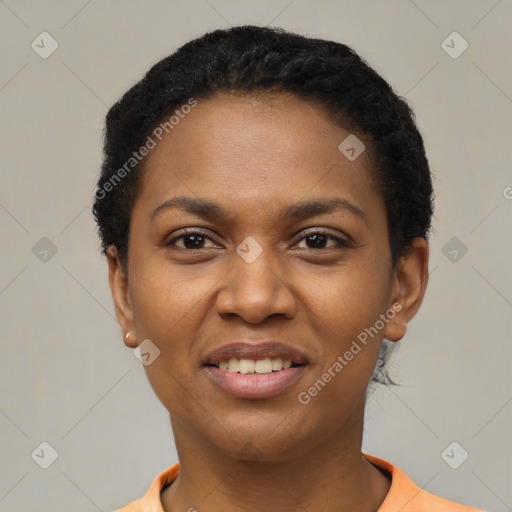 Joyful black young-adult female with short  black hair and brown eyes