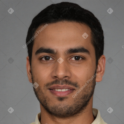 Joyful latino young-adult male with short  black hair and brown eyes