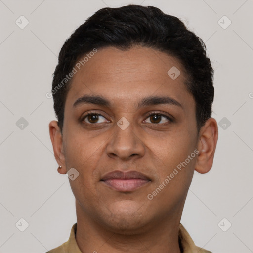 Joyful latino young-adult male with short  black hair and brown eyes