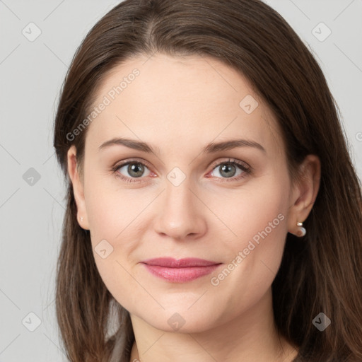 Joyful white young-adult female with long  brown hair and grey eyes