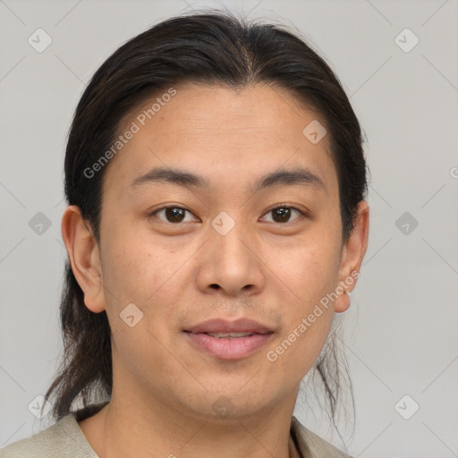 Joyful asian young-adult male with short  brown hair and brown eyes