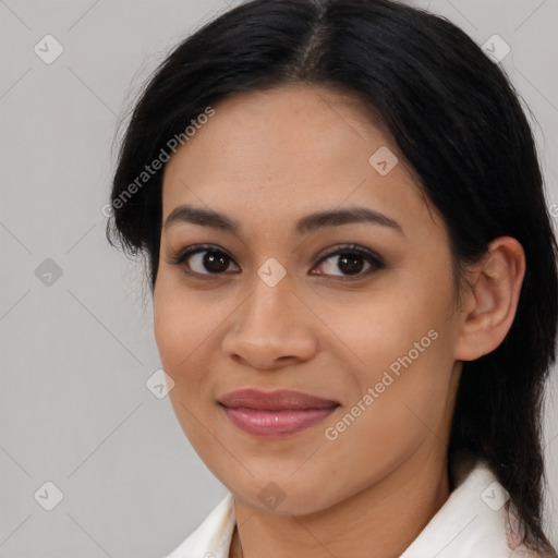 Joyful latino young-adult female with medium  brown hair and brown eyes