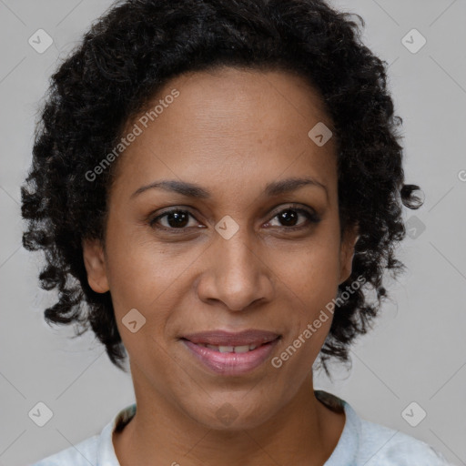 Joyful black adult female with short  brown hair and brown eyes