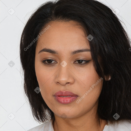 Joyful latino young-adult female with medium  black hair and brown eyes