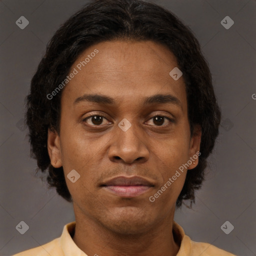 Joyful black adult female with short  brown hair and brown eyes
