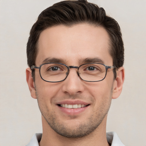 Joyful white young-adult male with short  brown hair and brown eyes