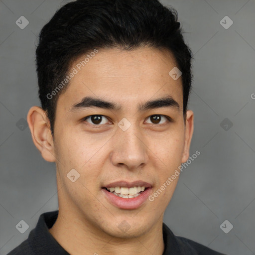 Joyful latino young-adult male with short  brown hair and brown eyes