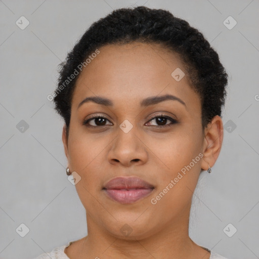 Joyful black young-adult female with short  brown hair and brown eyes