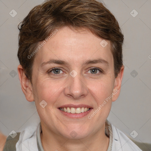 Joyful white adult female with medium  brown hair and grey eyes