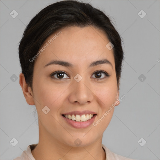 Joyful latino young-adult female with short  brown hair and brown eyes