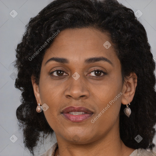 Joyful black adult female with medium  brown hair and brown eyes