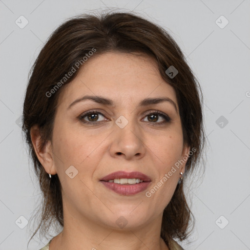 Joyful white adult female with medium  brown hair and brown eyes