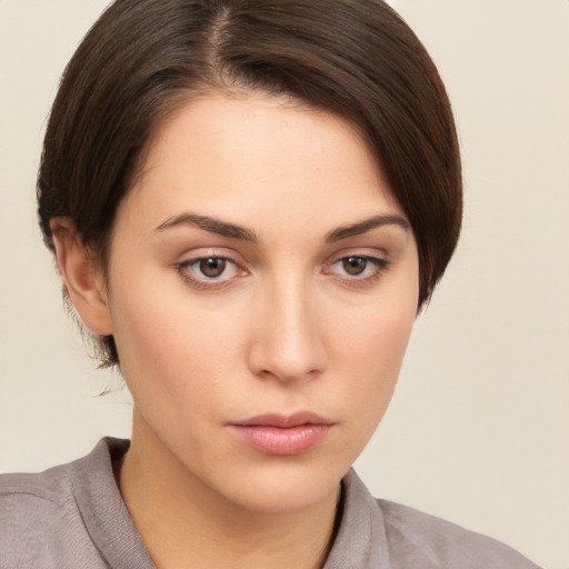 Neutral white young-adult female with short  brown hair and brown eyes