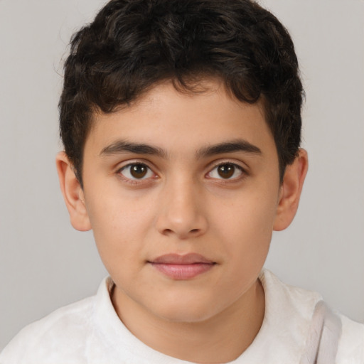 Joyful white child male with short  brown hair and brown eyes