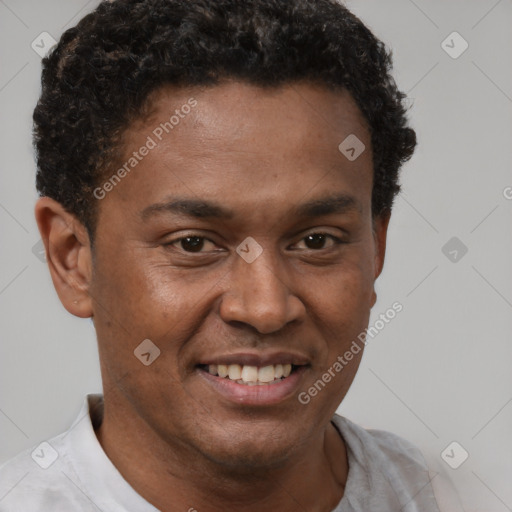 Joyful latino young-adult male with short  brown hair and brown eyes