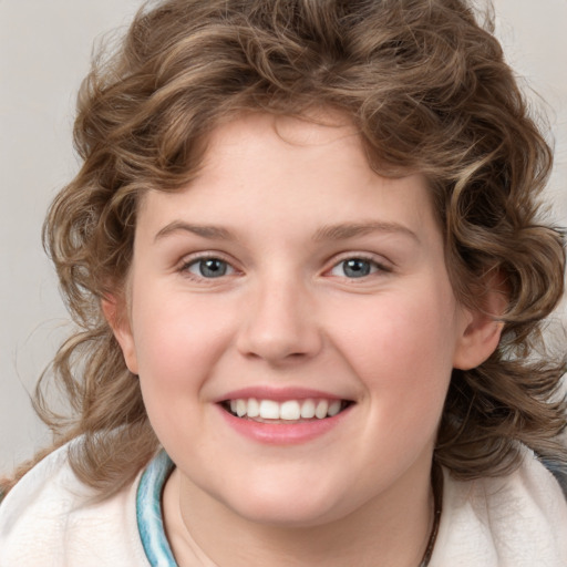 Joyful white child female with medium  brown hair and blue eyes