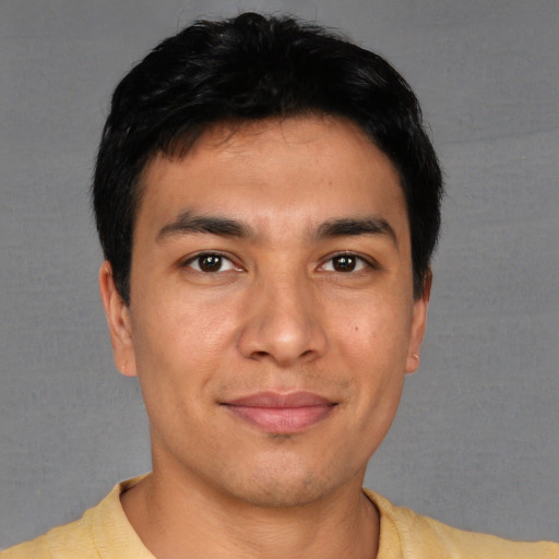 Joyful asian young-adult male with short  black hair and brown eyes