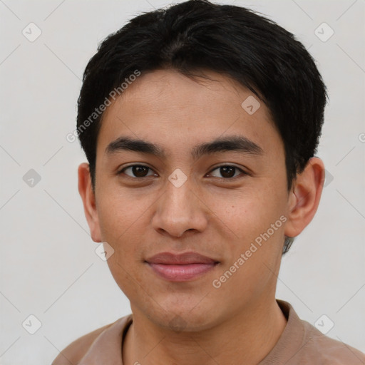 Joyful white young-adult male with short  black hair and brown eyes