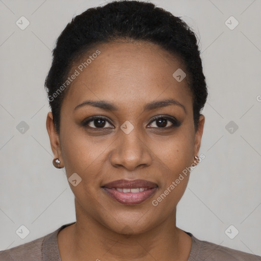 Joyful black young-adult female with short  black hair and brown eyes