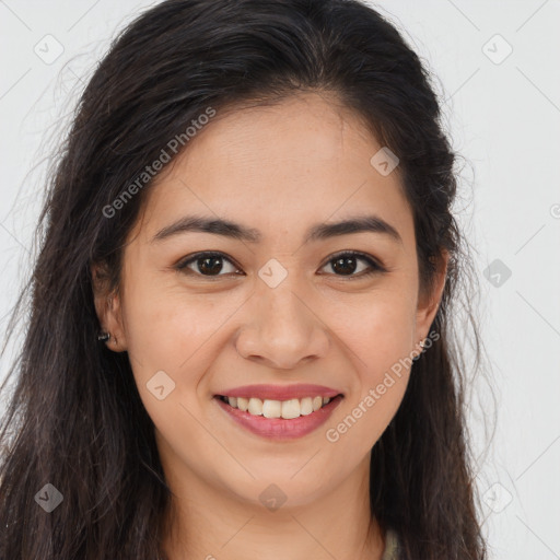 Joyful latino young-adult female with long  brown hair and brown eyes