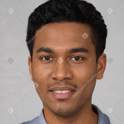 Joyful latino young-adult male with short  black hair and brown eyes