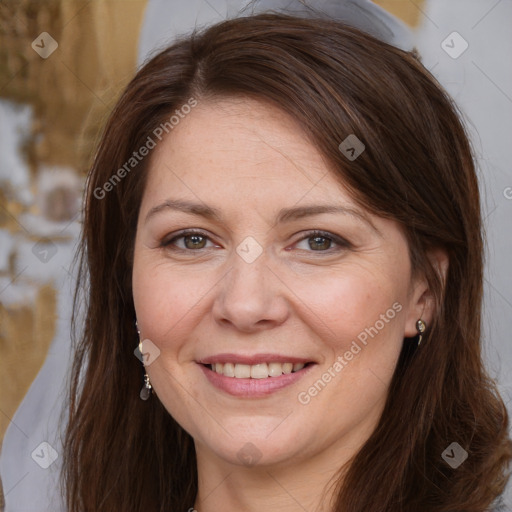 Joyful white adult female with long  brown hair and brown eyes