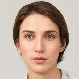 Neutral white young-adult female with medium  brown hair and grey eyes