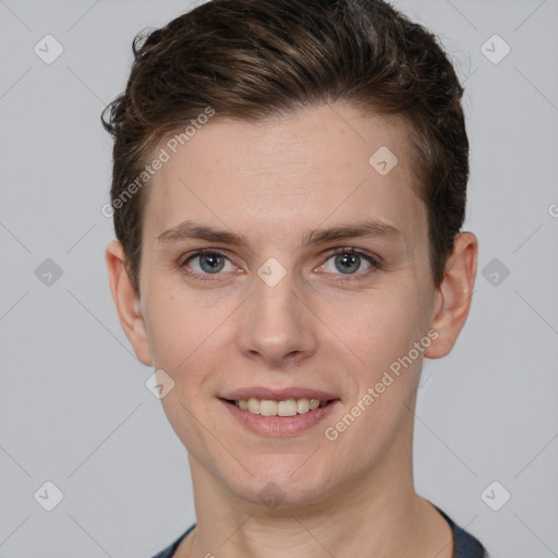 Joyful white young-adult female with short  brown hair and grey eyes