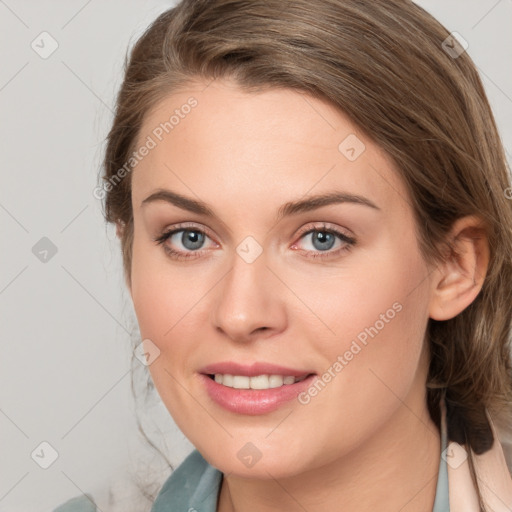 Joyful white young-adult female with long  brown hair and blue eyes