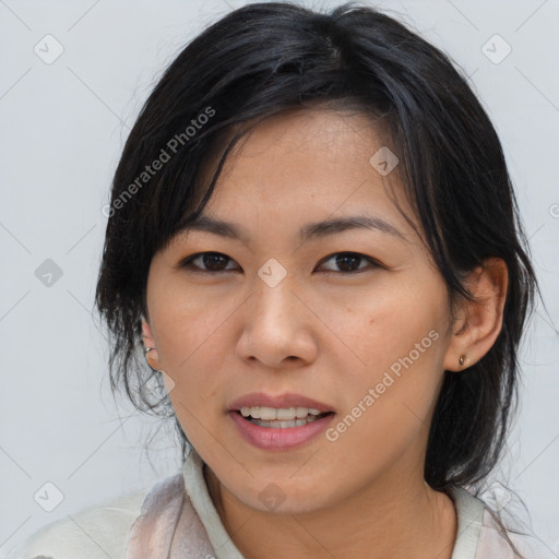 Joyful asian young-adult female with medium  brown hair and brown eyes