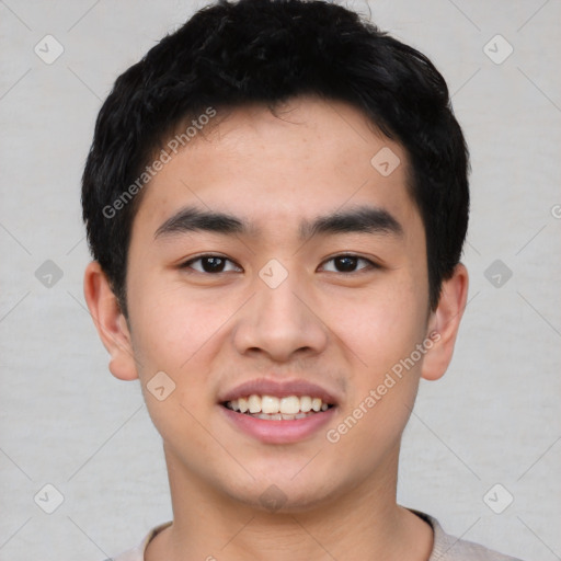 Joyful asian young-adult male with short  black hair and brown eyes