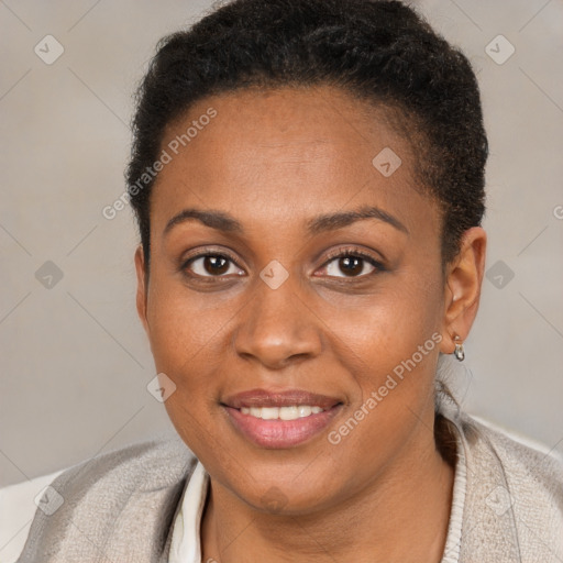 Joyful black young-adult female with short  brown hair and brown eyes