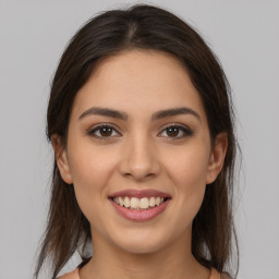 Joyful white young-adult female with medium  brown hair and brown eyes