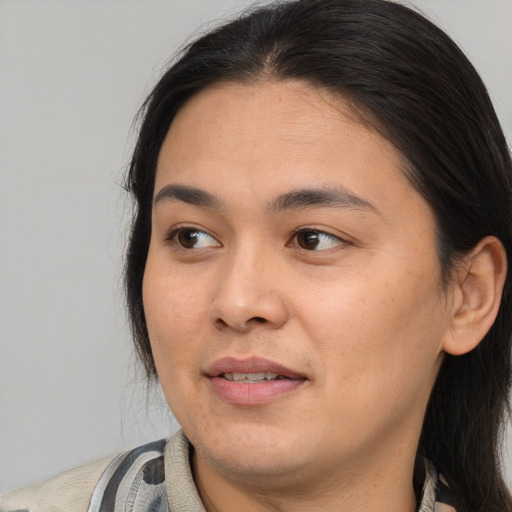 Joyful latino young-adult female with medium  black hair and brown eyes