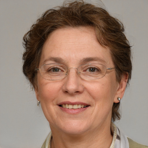 Joyful white middle-aged female with medium  brown hair and blue eyes