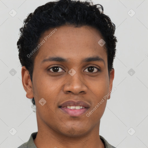 Joyful black young-adult male with short  black hair and brown eyes
