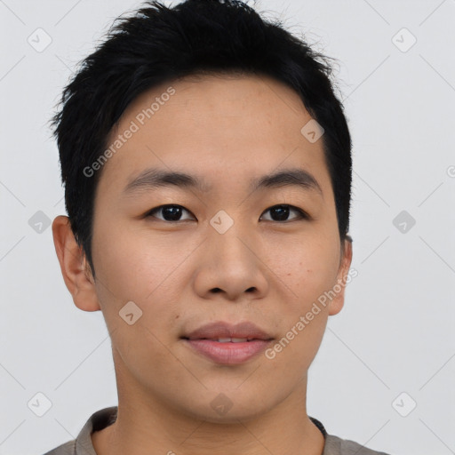 Joyful asian young-adult male with short  black hair and brown eyes