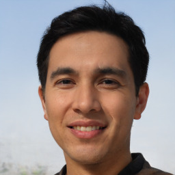 Joyful asian young-adult male with short  black hair and brown eyes