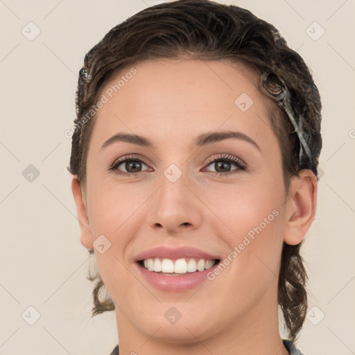 Joyful white young-adult female with medium  brown hair and brown eyes